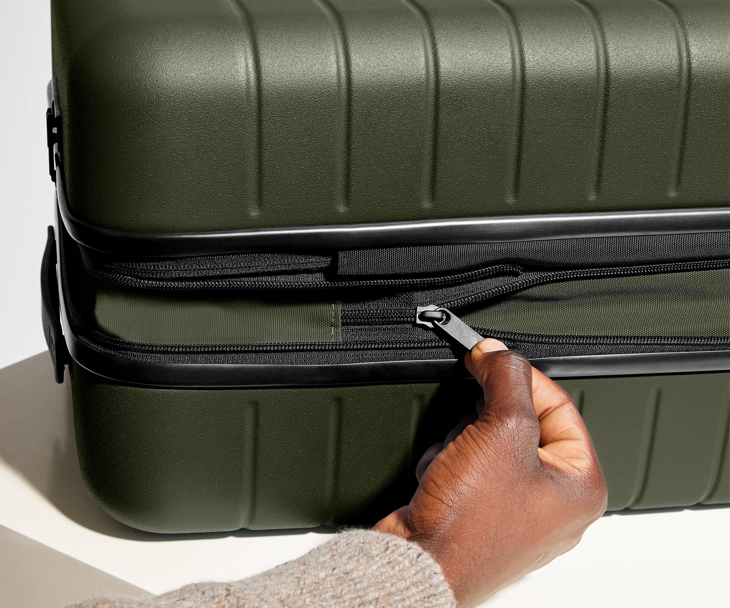 Hand unzipping the wraparound expansion feature