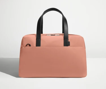 Front view of The Overnight Bag with leather straps up