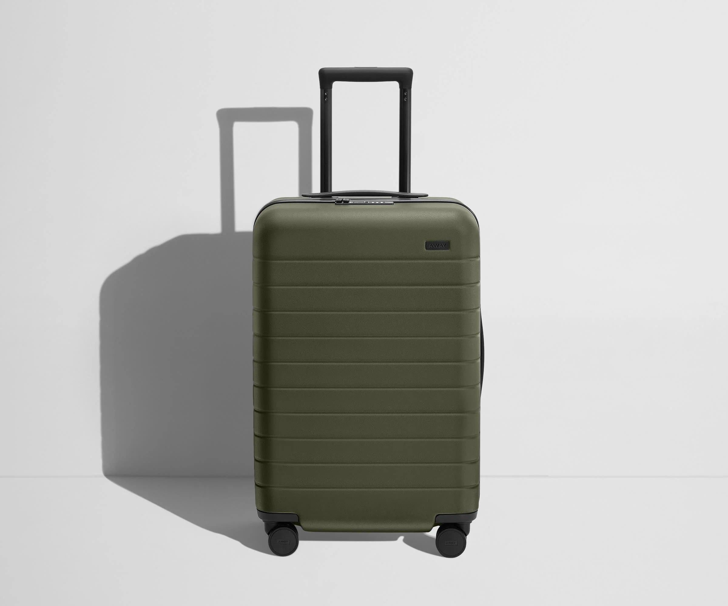 Angled product view of The Bigger Carry-On Flex suitcase in Olive Green