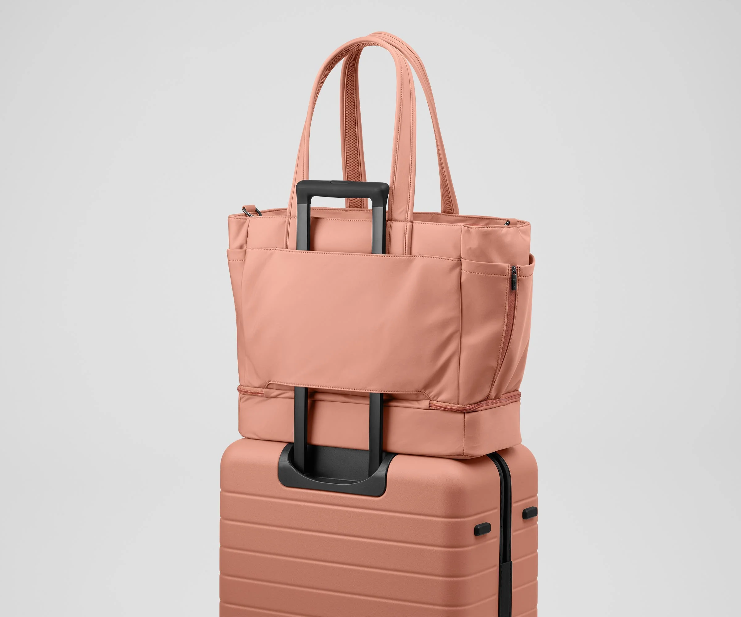 Double Diaper Tote on top of an Away suitcase by the trolley sleeve