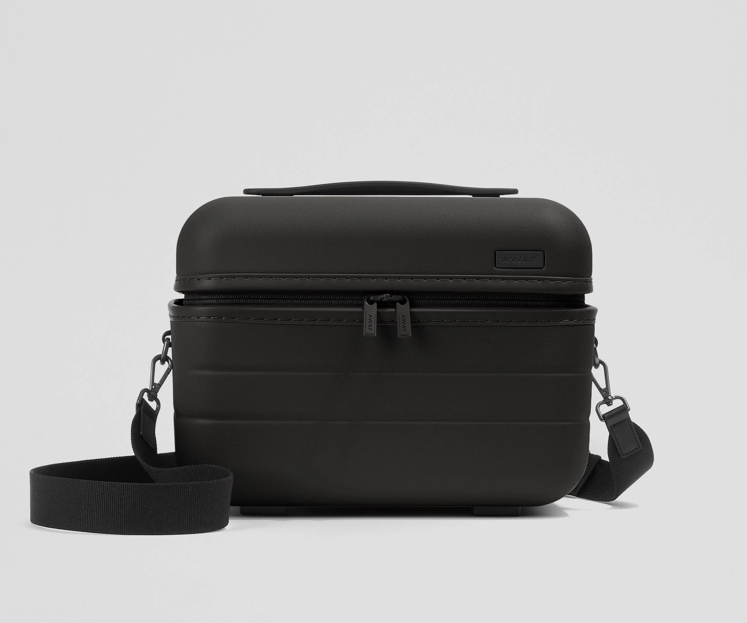 Front view of the Train Case with a detachable shoulder strap