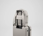 Double Diaper Backpack on top of an Away suitcase by the trolley sleeve