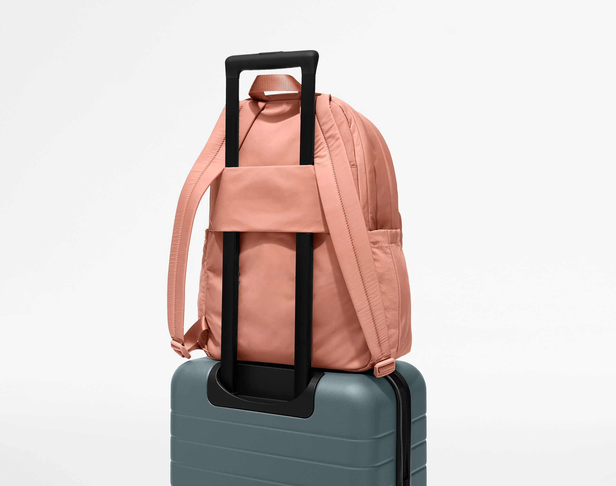 Large Featherlight Backpack on top of an Away suitcase