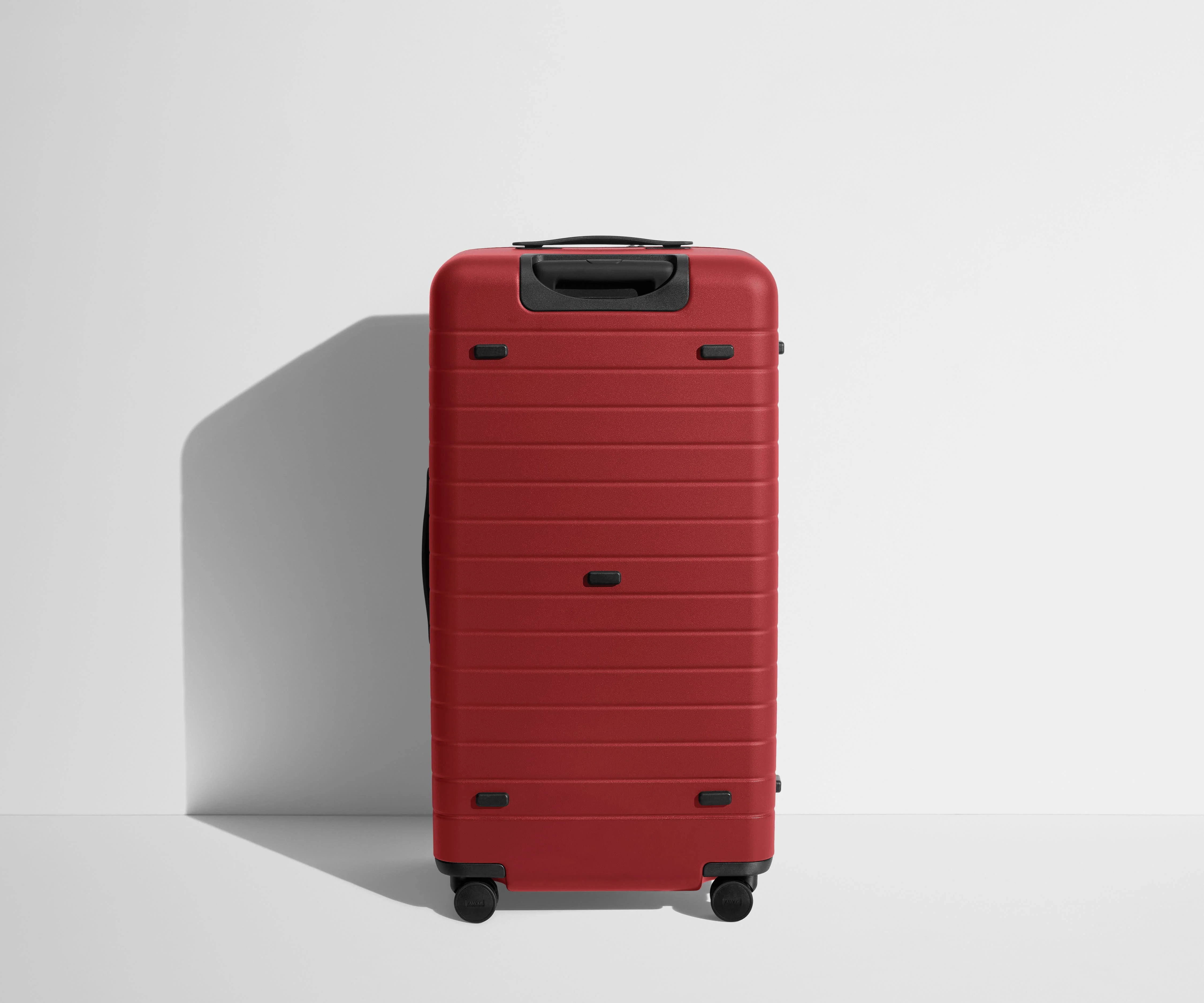 Back product view of The Trunk suitcase in Tango Red