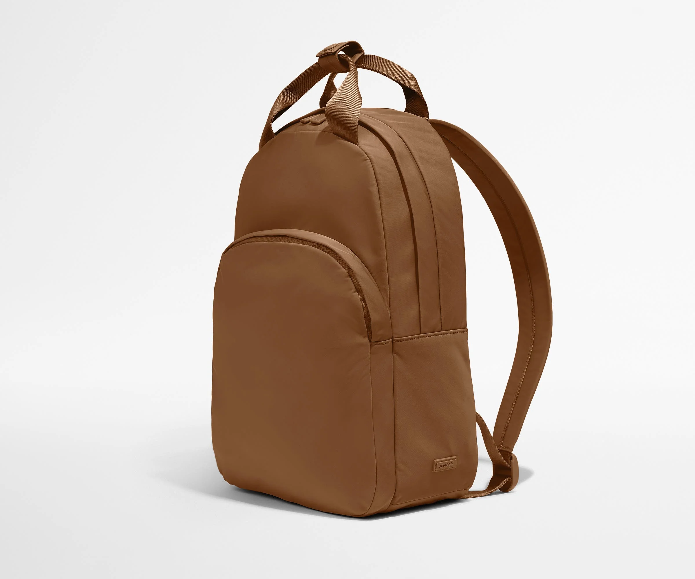 Video of a person packing the Featherlight Backpack with daily essentials