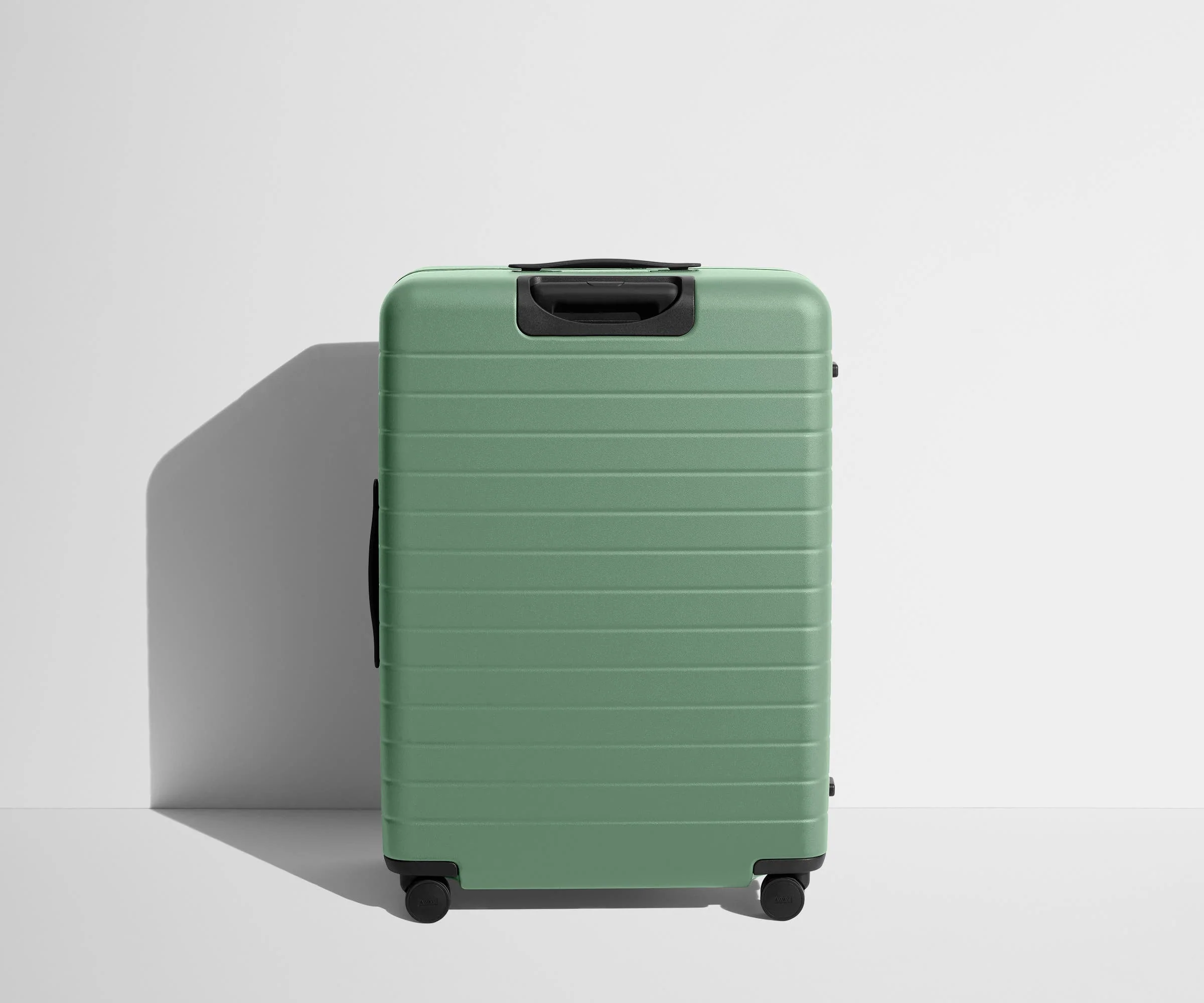 Back product view of The Large suitcase in Sea Green