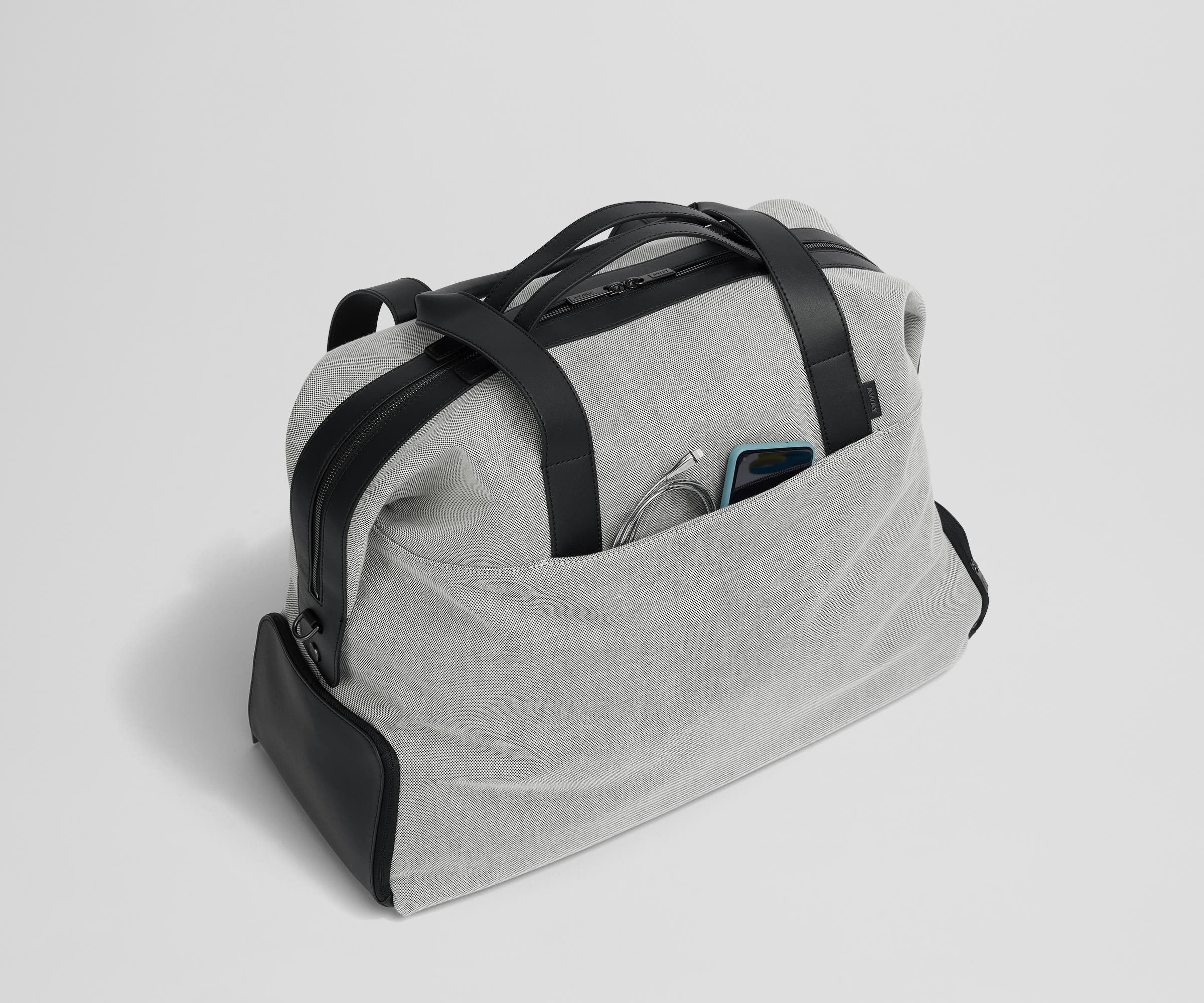 Phone and charging cord in the exterior slip pocket