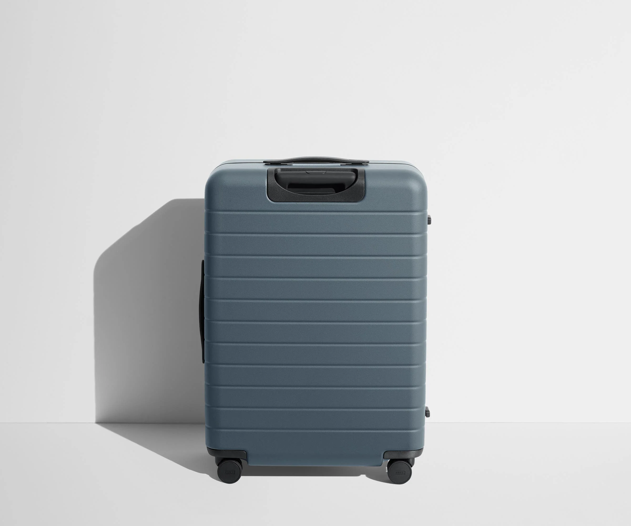 Back product view of The Medium suitcase in Coast Blue