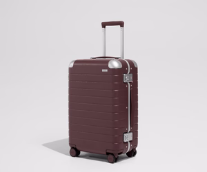 The Aluminum Edge Bigger Carry-On in Oxblood Red