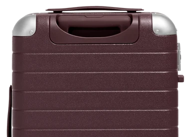 The Aluminum Edge Bigger Carry-On in Oxblood Red