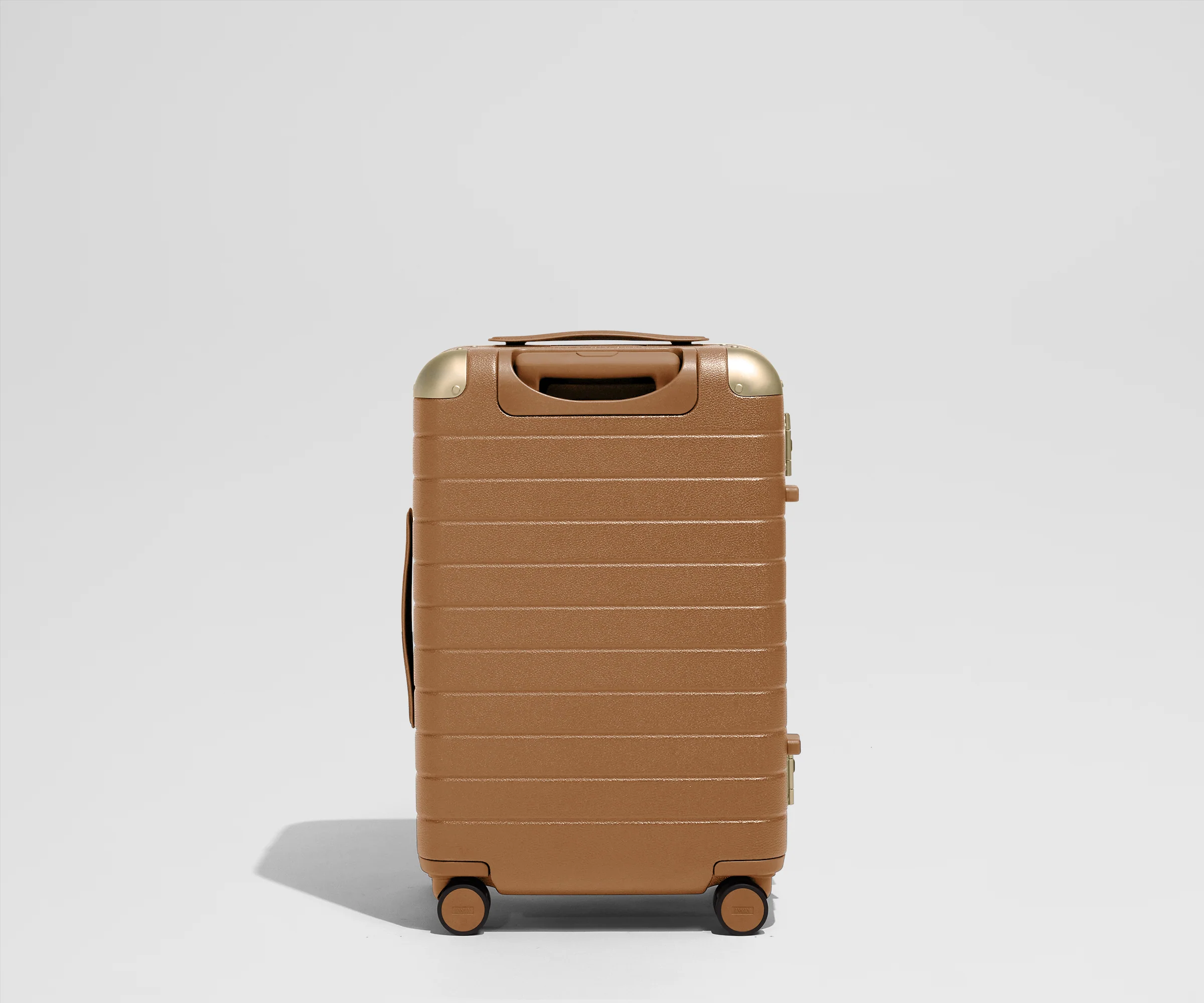 The Aluminum Edge Bigger Carry-On in Cognac Brown