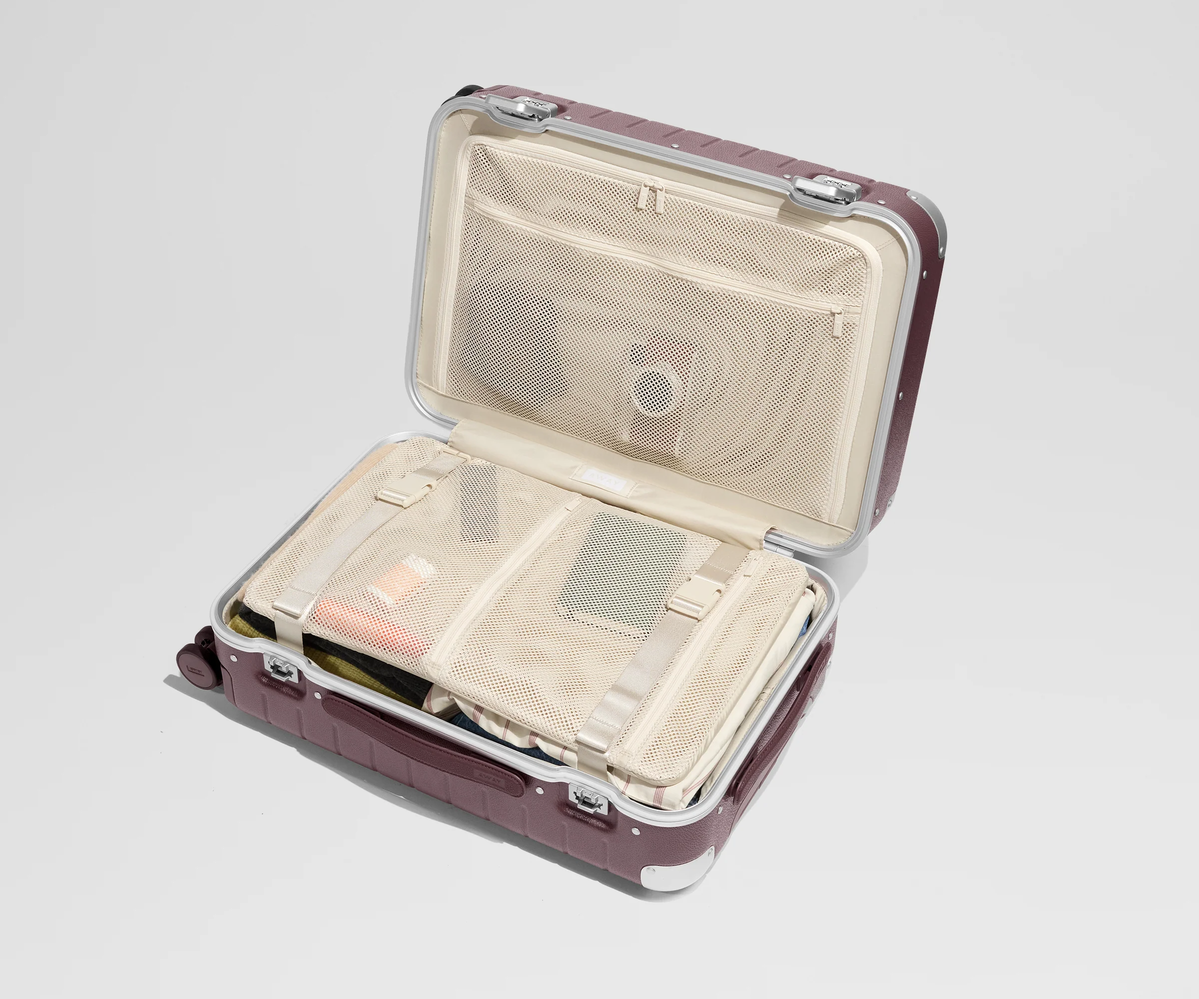 The Aluminum Edge Bigger Carry-On in Oxblood Red