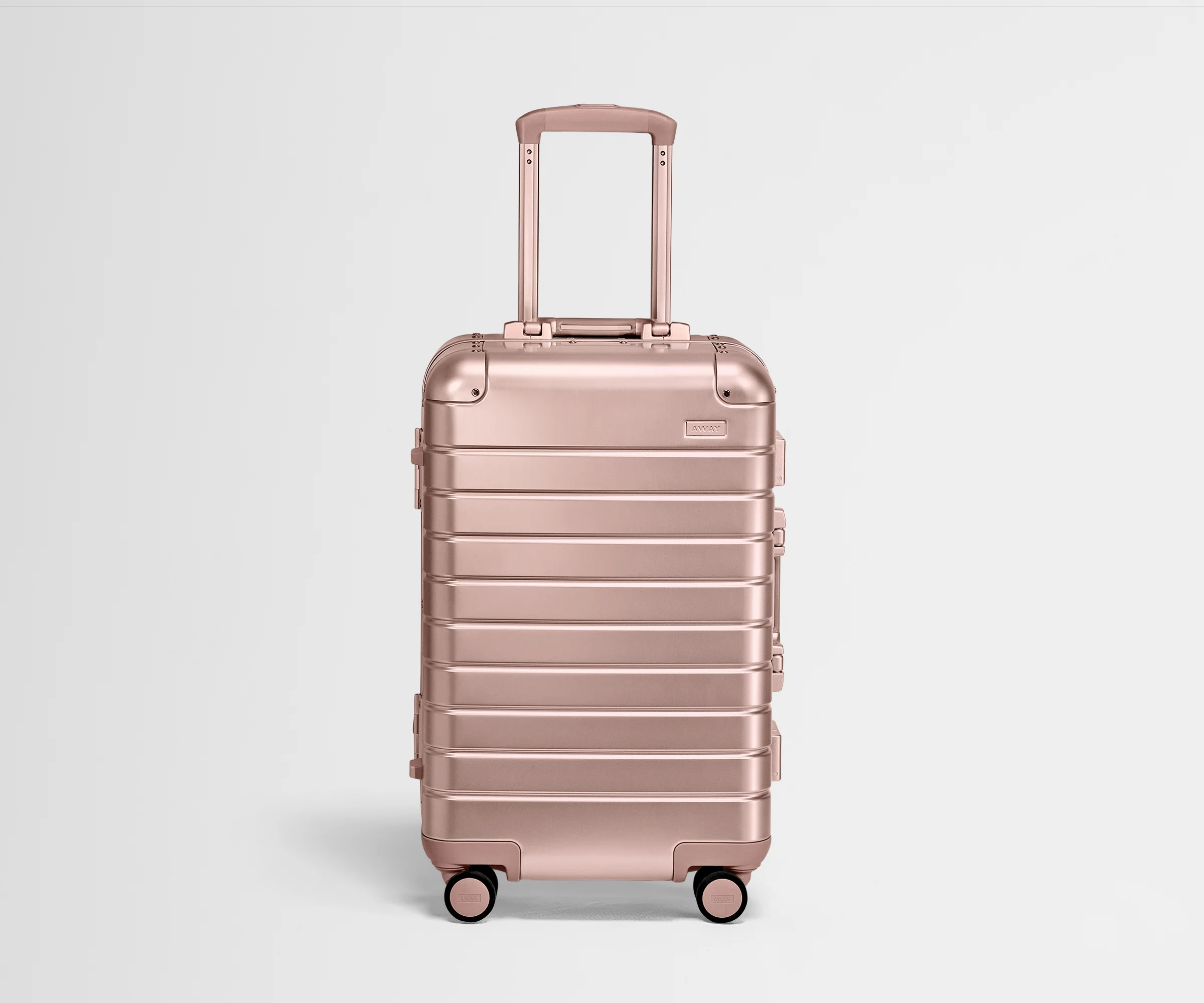 Front product view of a Rose Gold Aluminum Bigger Carry-On with handles raised