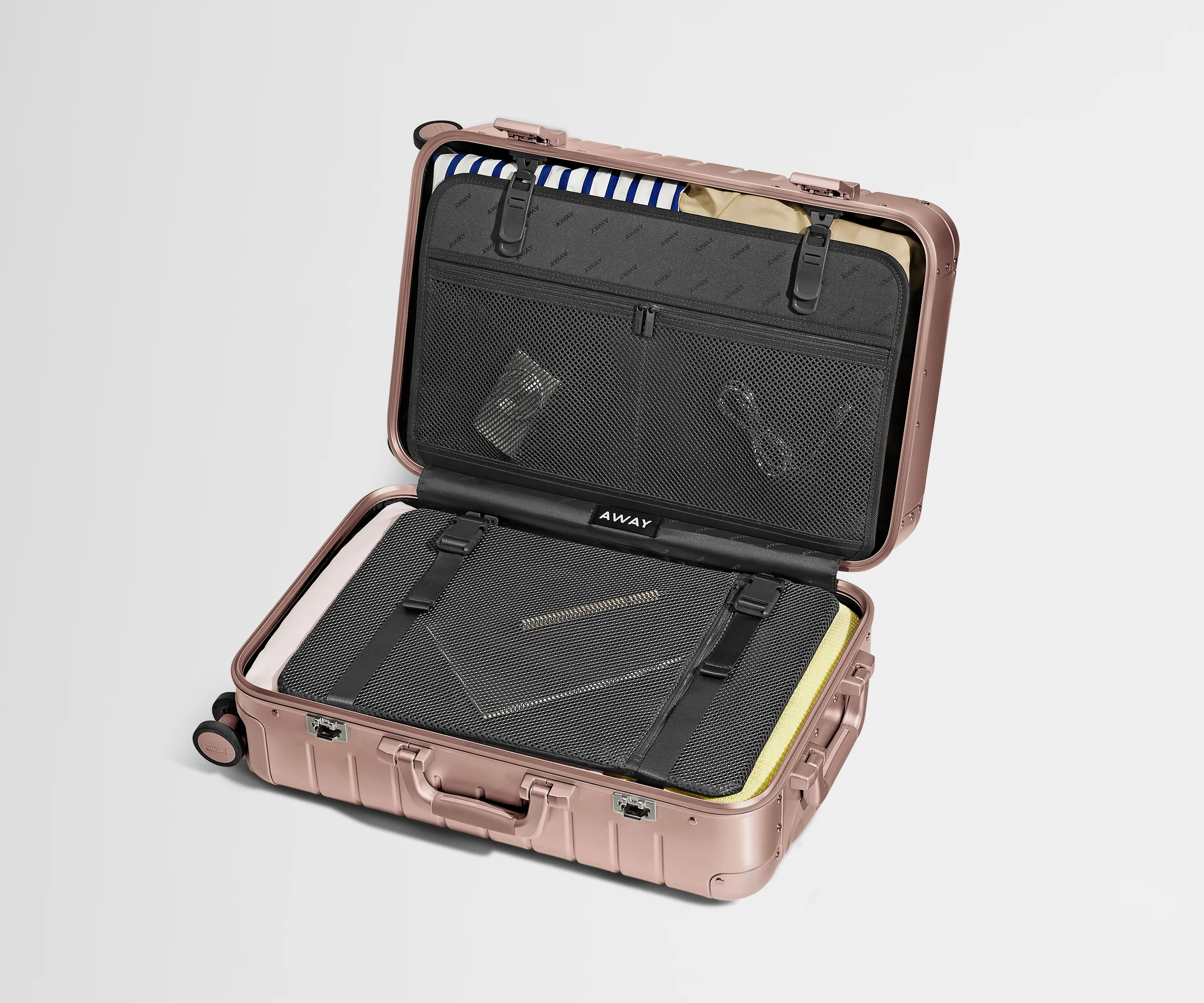 Open Aluminum Bigger Carry-On, showing compression pad system and interior organization