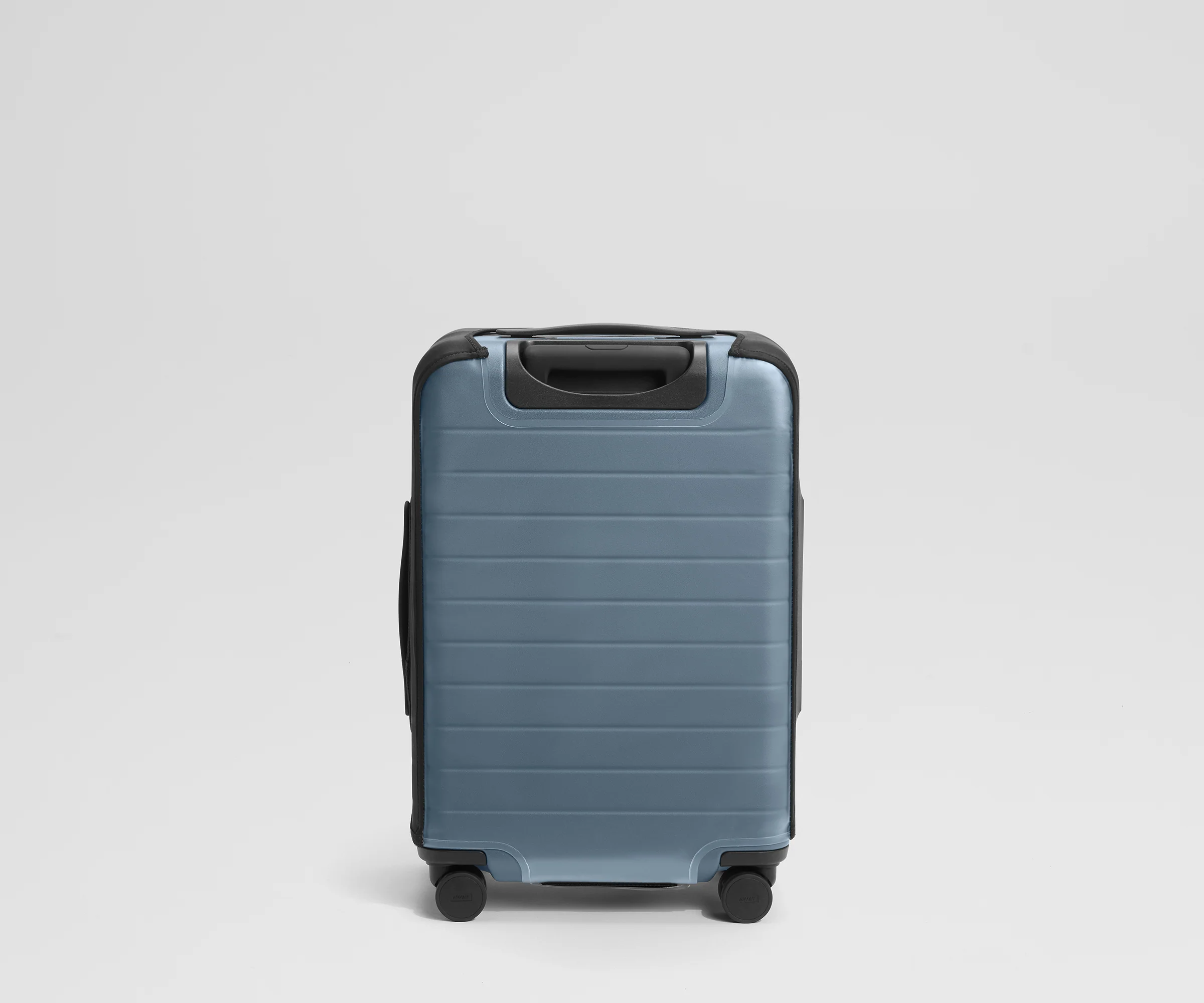 Clear Luggage Cover in The Bigger Carry-On