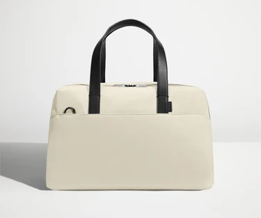 Front view of The Overnight Bag with leather straps up