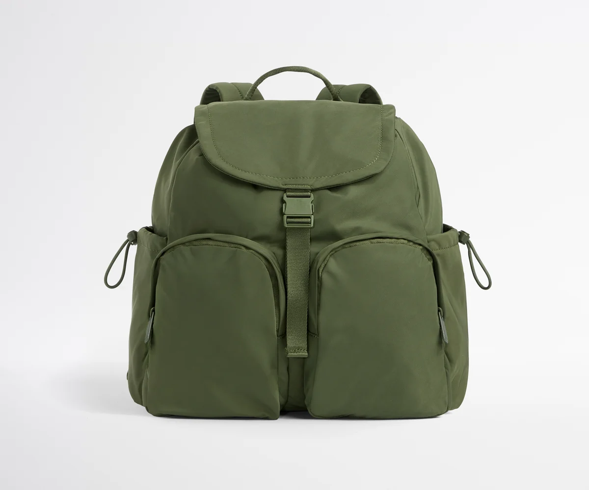 Green backpack on a white background