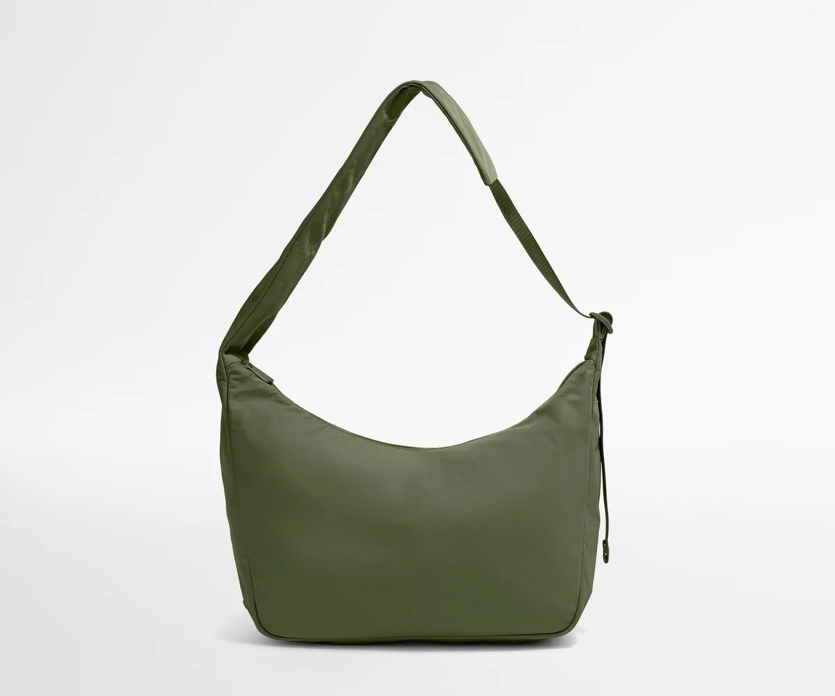 Green shoulder bag on a light gray background