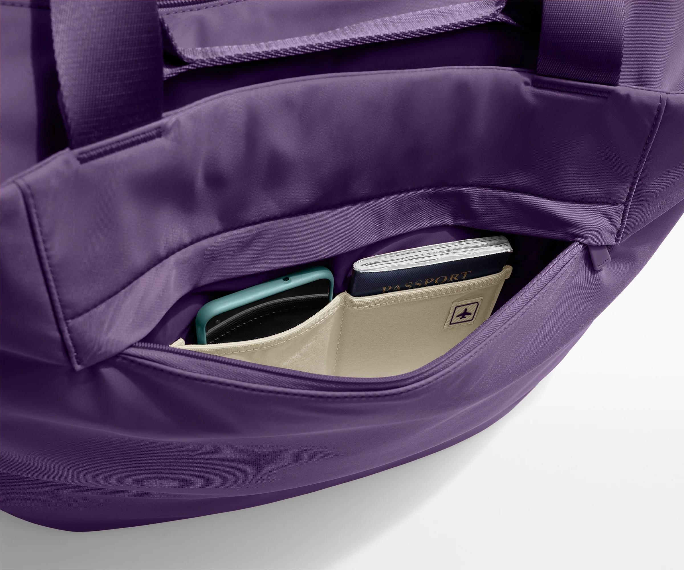 Phone and passport packed in an exterior zip pocket
