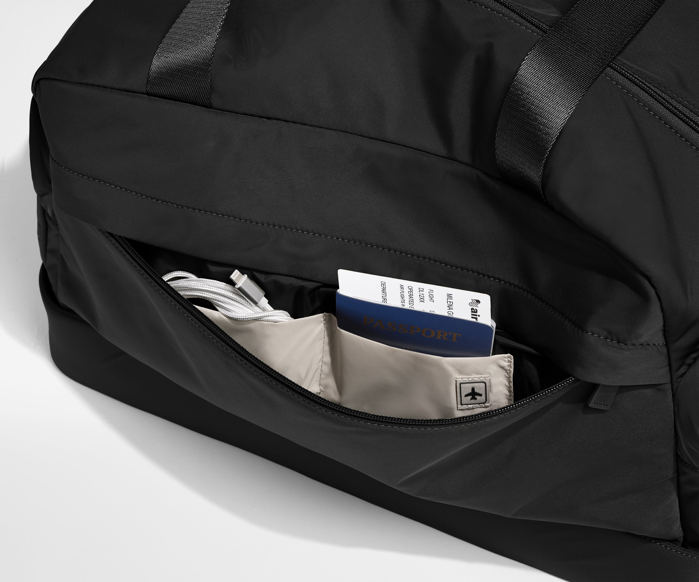 Front zipper pocket with phone and passport in their dedicated travel pockets
