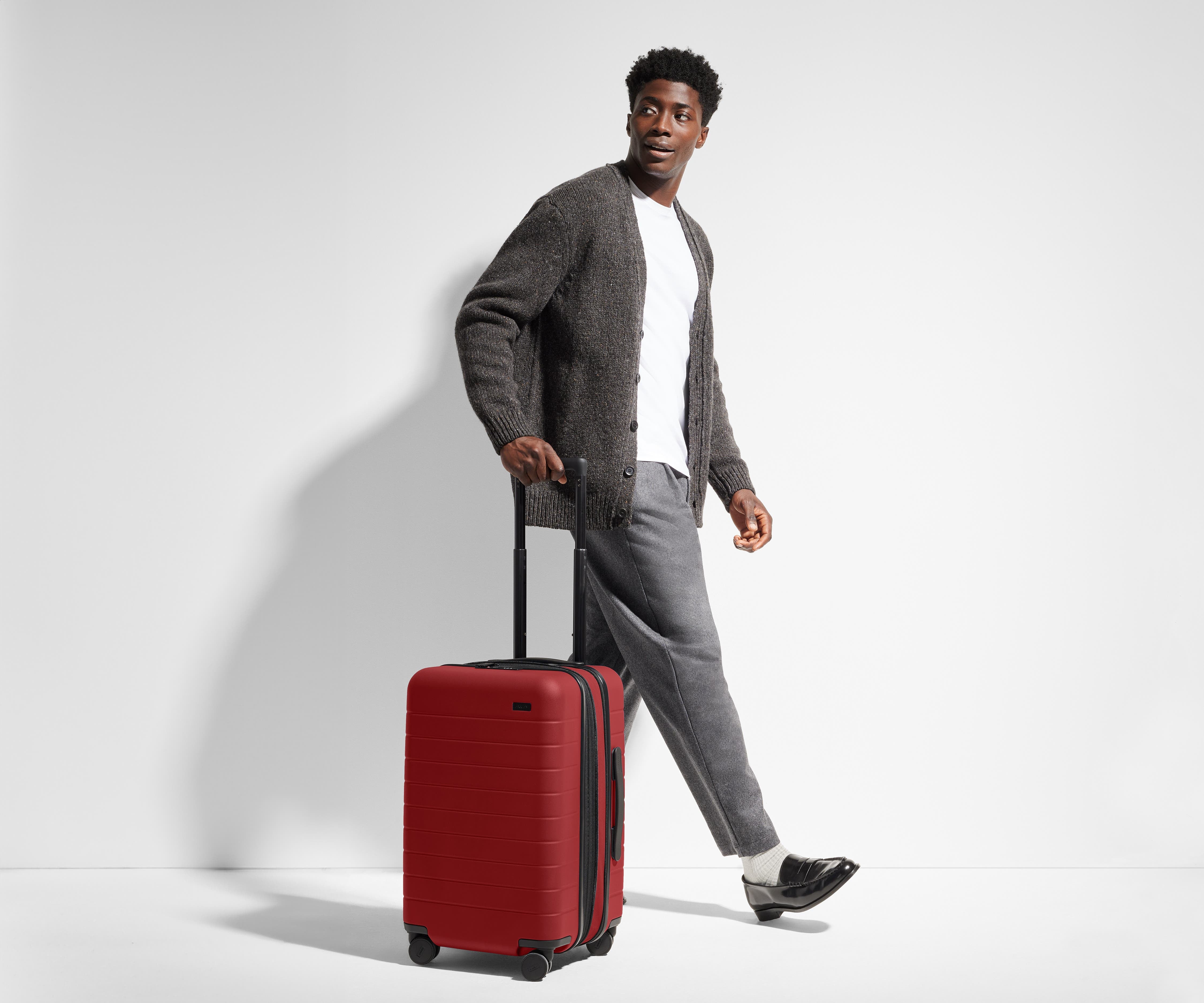 6'1" person walking with The Carry-On Flex
// Model is 6'1"
