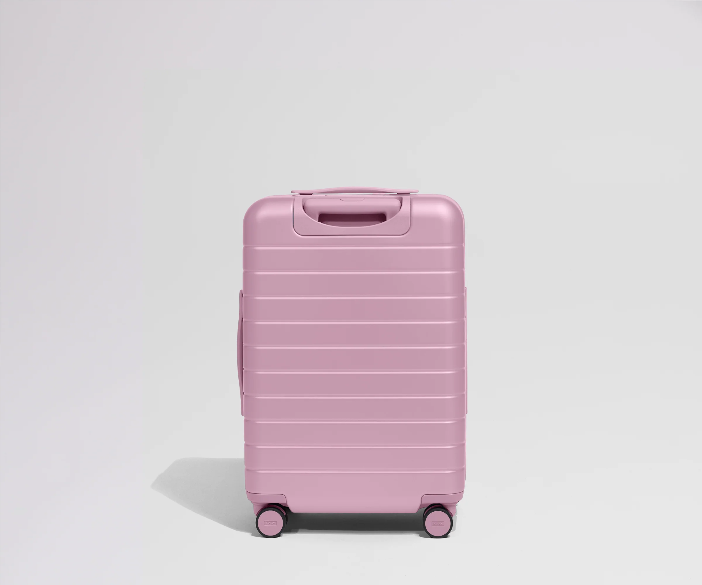 Pink suitcase on a light gray background