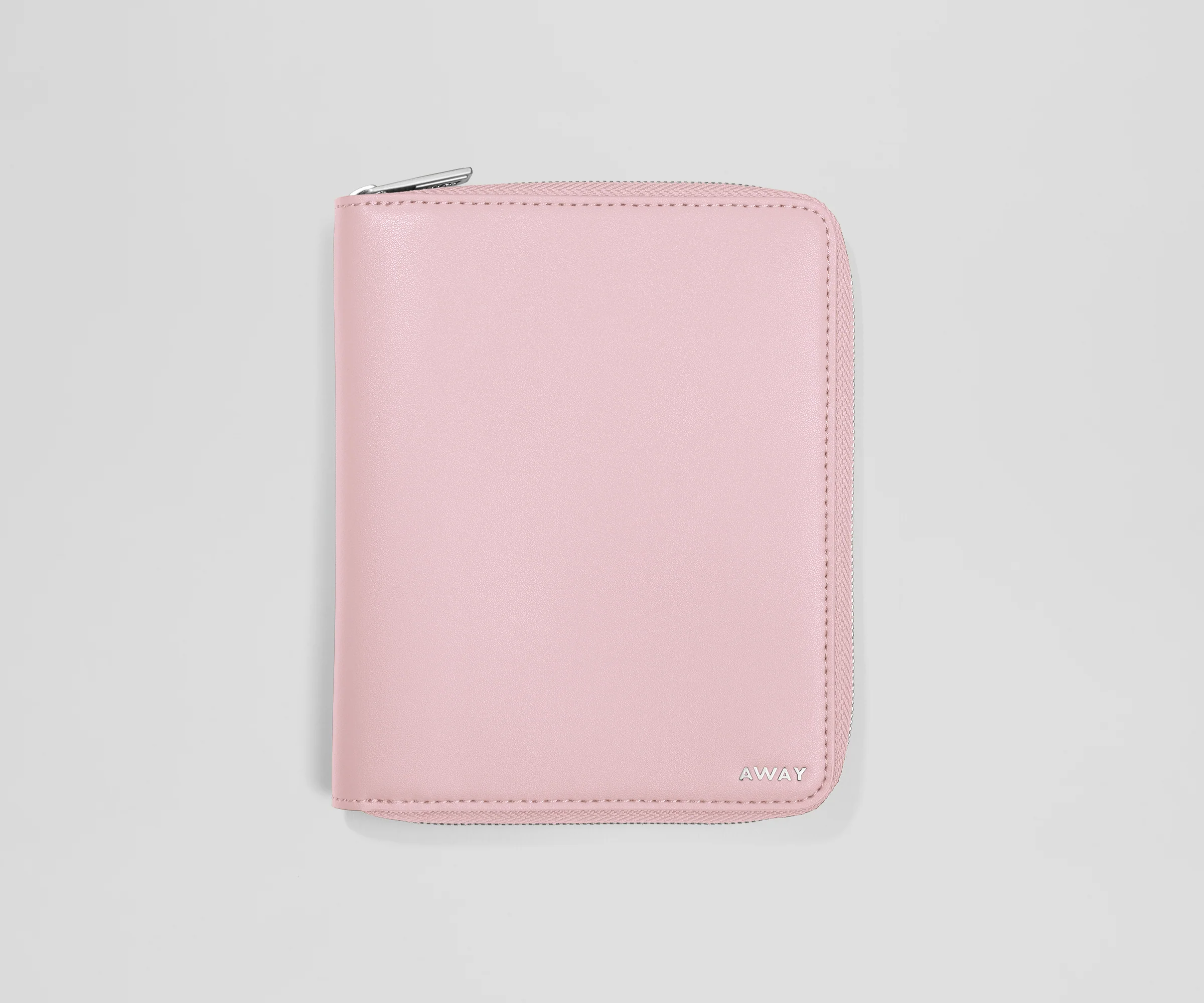 Pink wallet with a brand logo on a light gray background