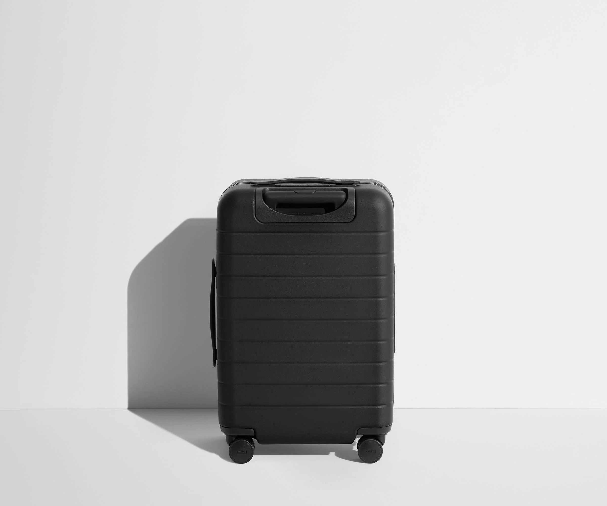 Back product view of The Carry-On Flex suitcase in Jet Black