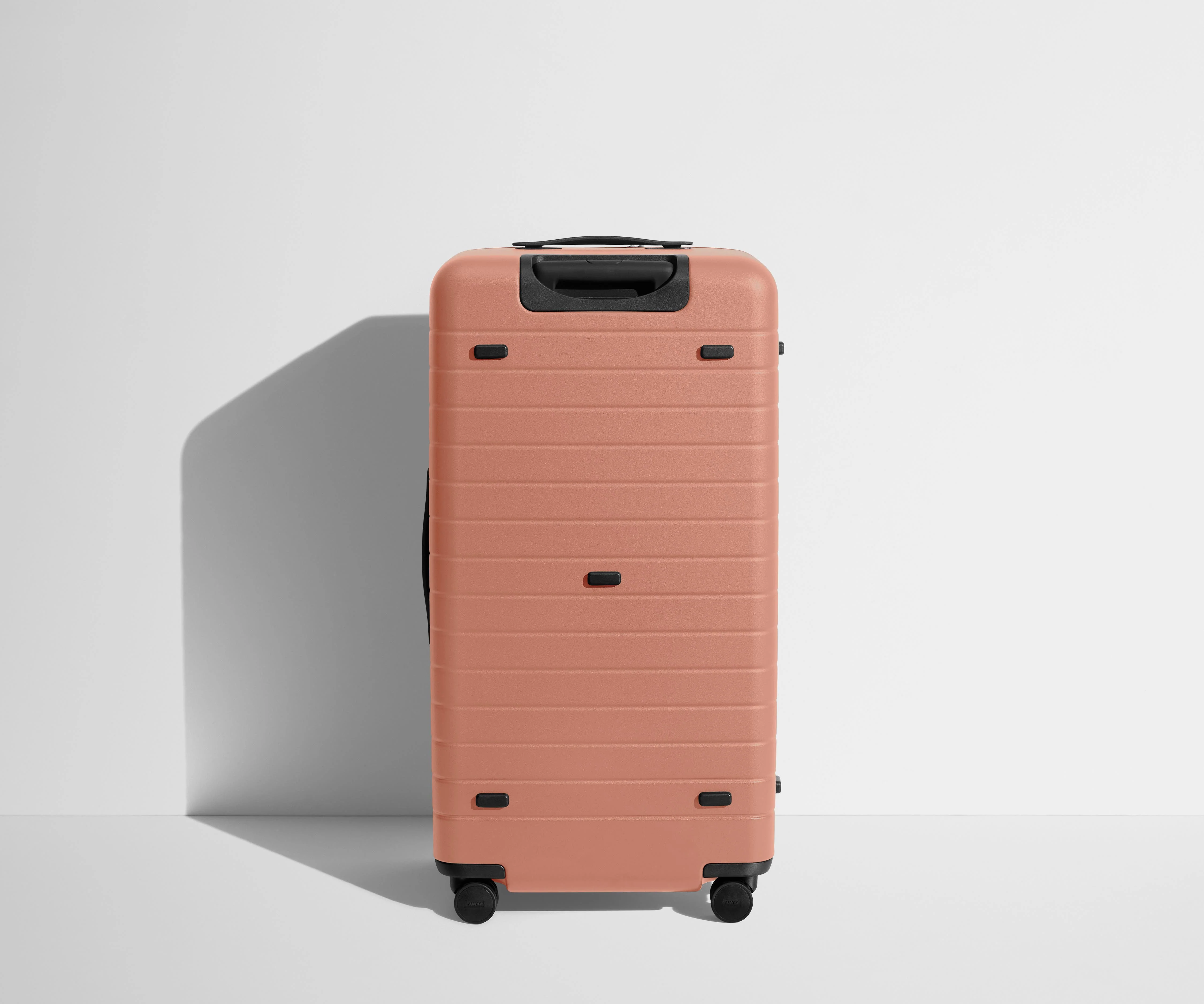 Back product view of The Trunk suitcase in Clay Pink