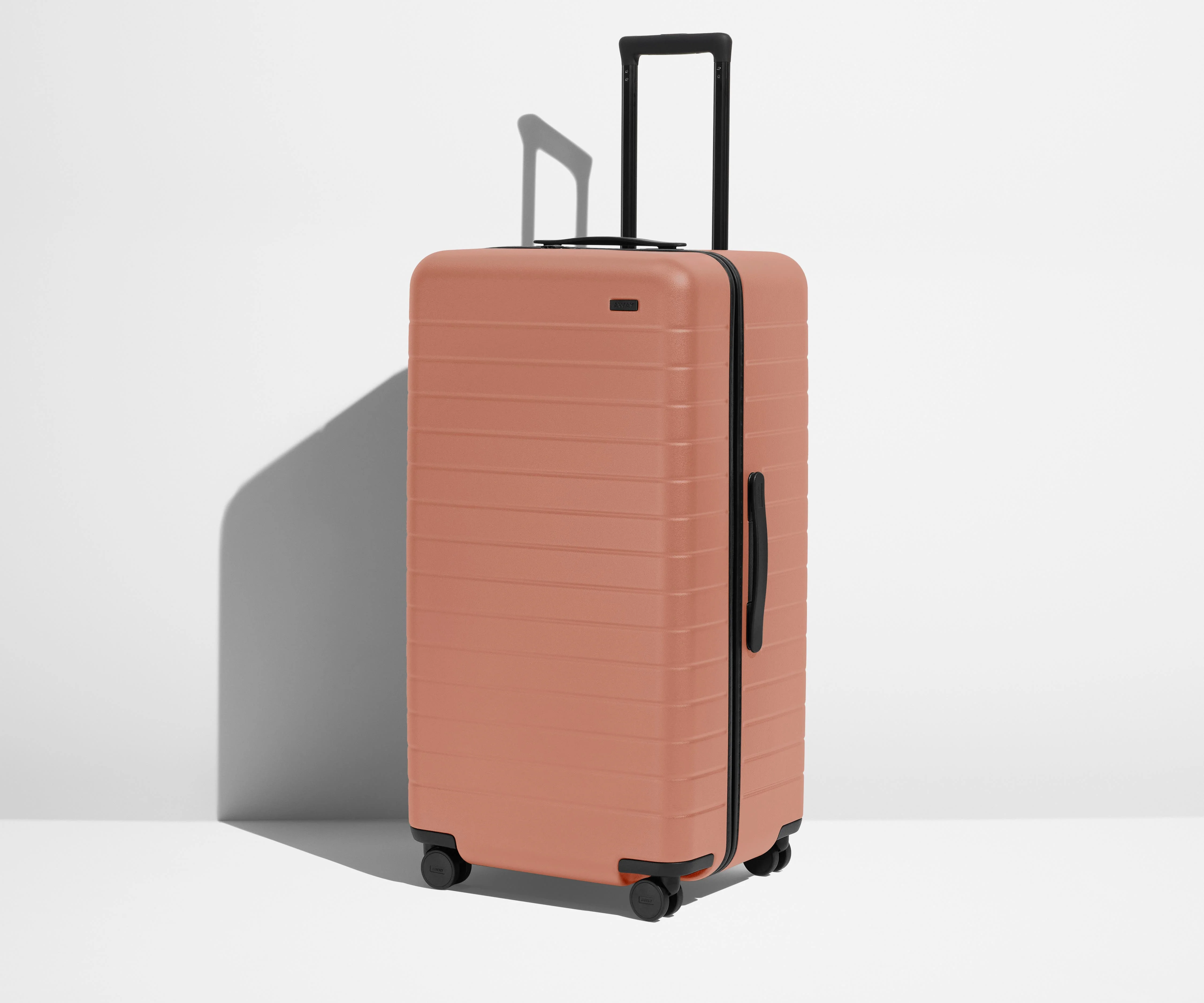 Angled product view of The Trunk suitcase in Clay Pink