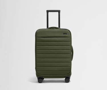 Front product view of The Softside Bigger Carry-On suitcase in Olive Green with raised handle