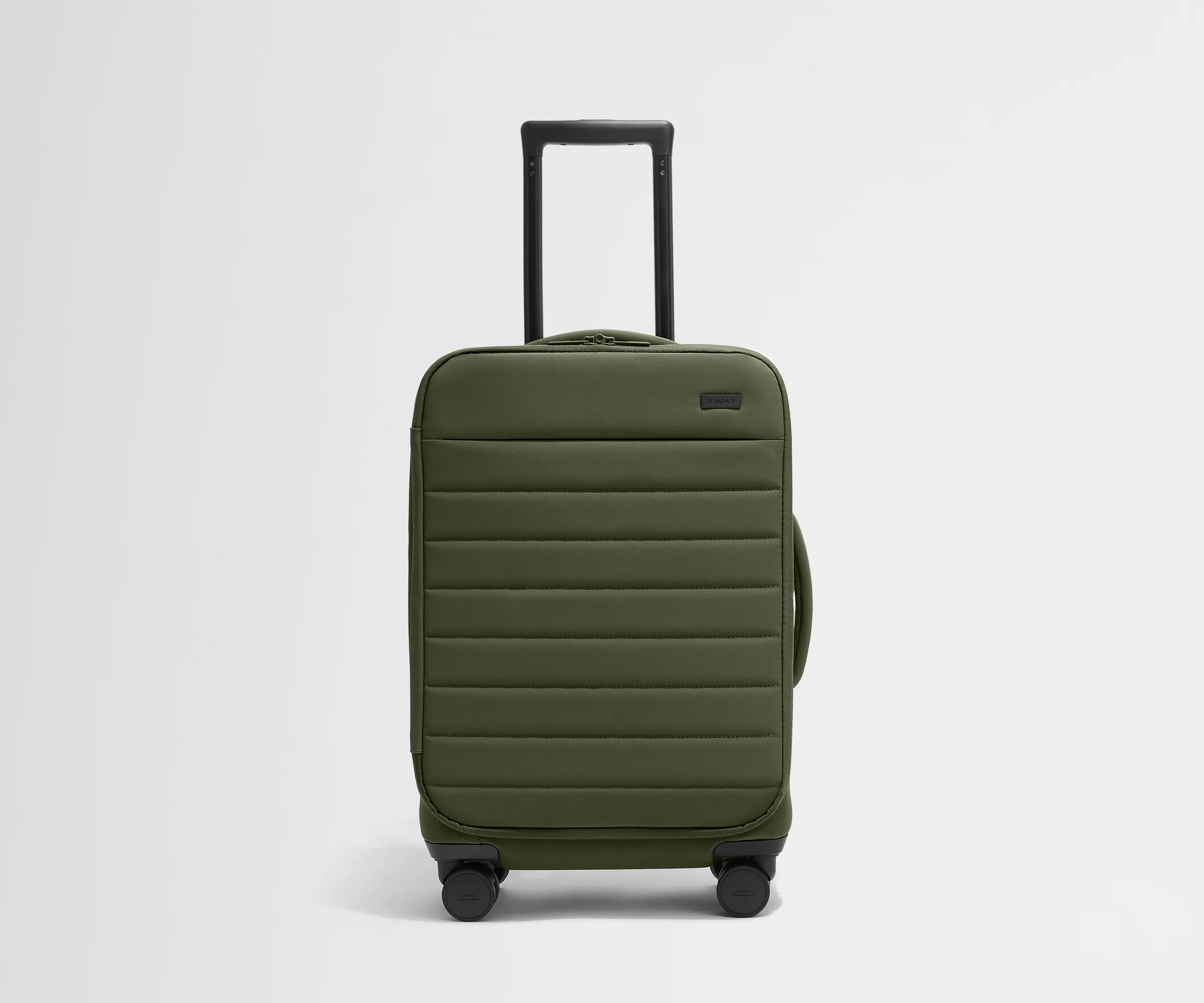 Front product view of The Softside Carry-On suitcase in Olive Green with raised handle