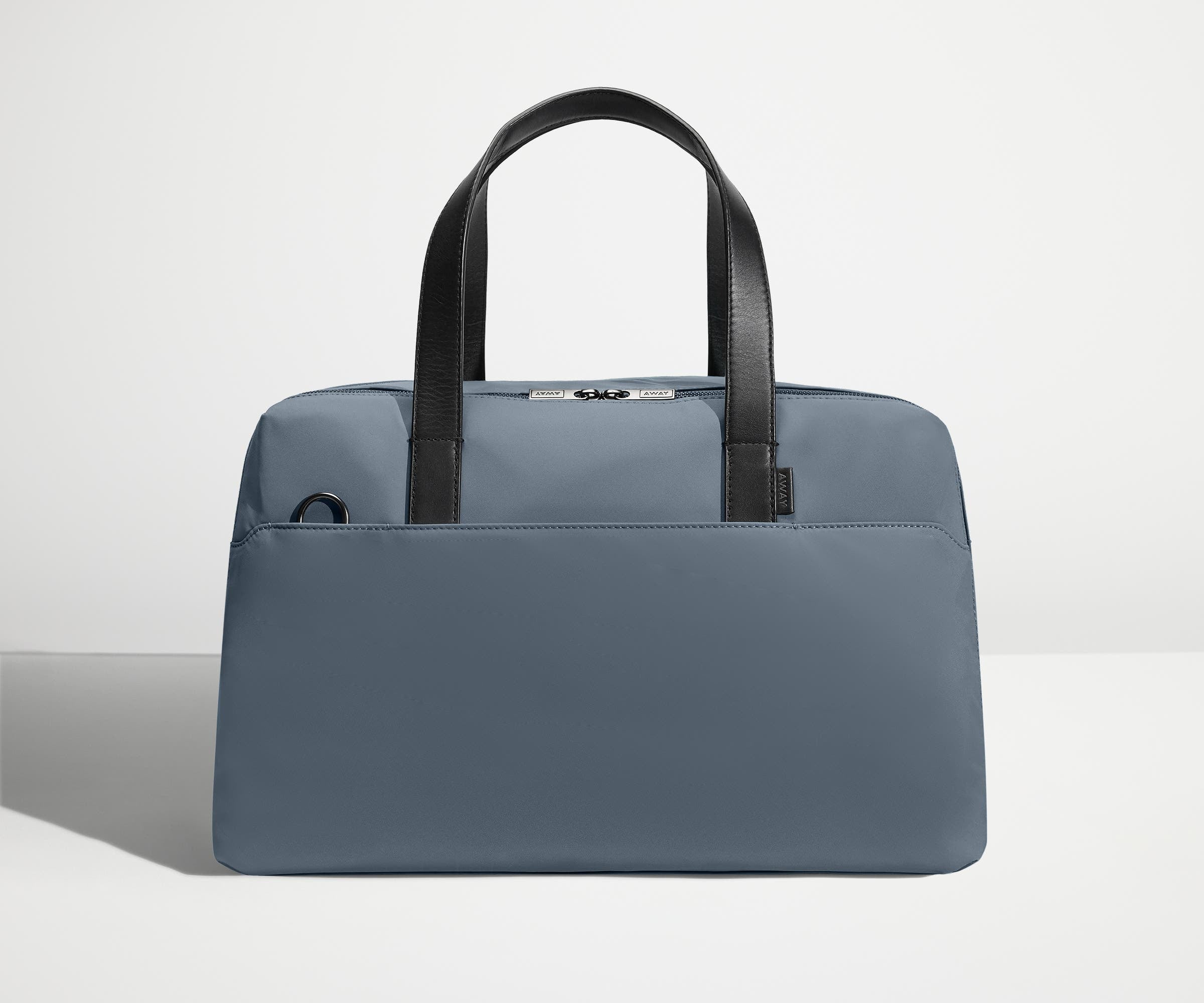 Front view of The Overnight Bag with leather straps up