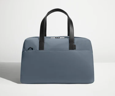 Front view of The Overnight Bag with leather straps up