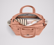 Back main compartment packed with adult travel essentials, including a laptop, notebook, and extra clothes