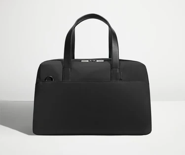 Front view of The Overnight Bag with leather straps up