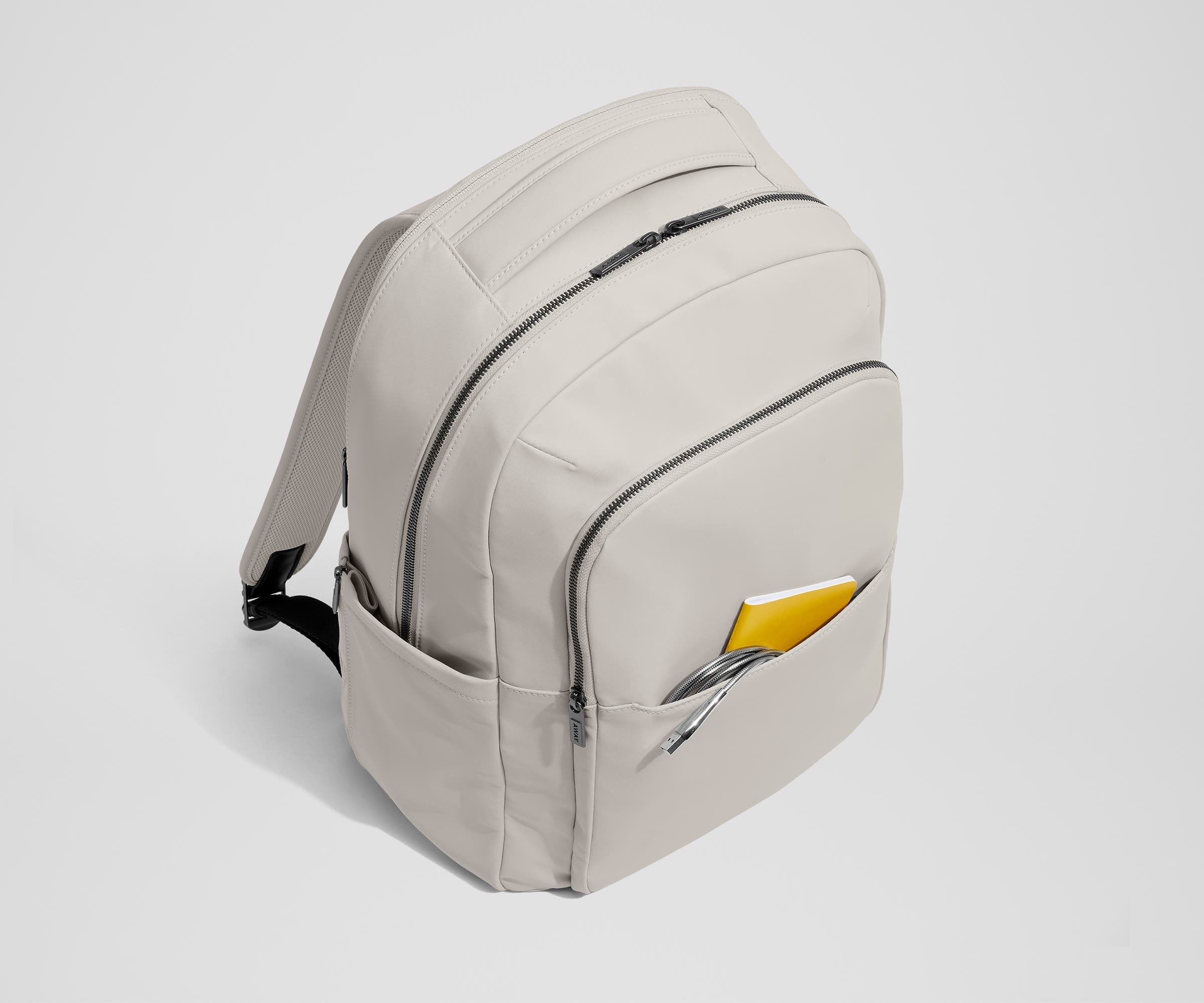 Front slip pocket with small notebook and charging cord