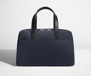 Front view of The Overnight Bag with leather straps up