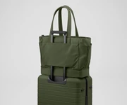Double Diaper Tote on top of an Away suitcase by the trolley sleeve