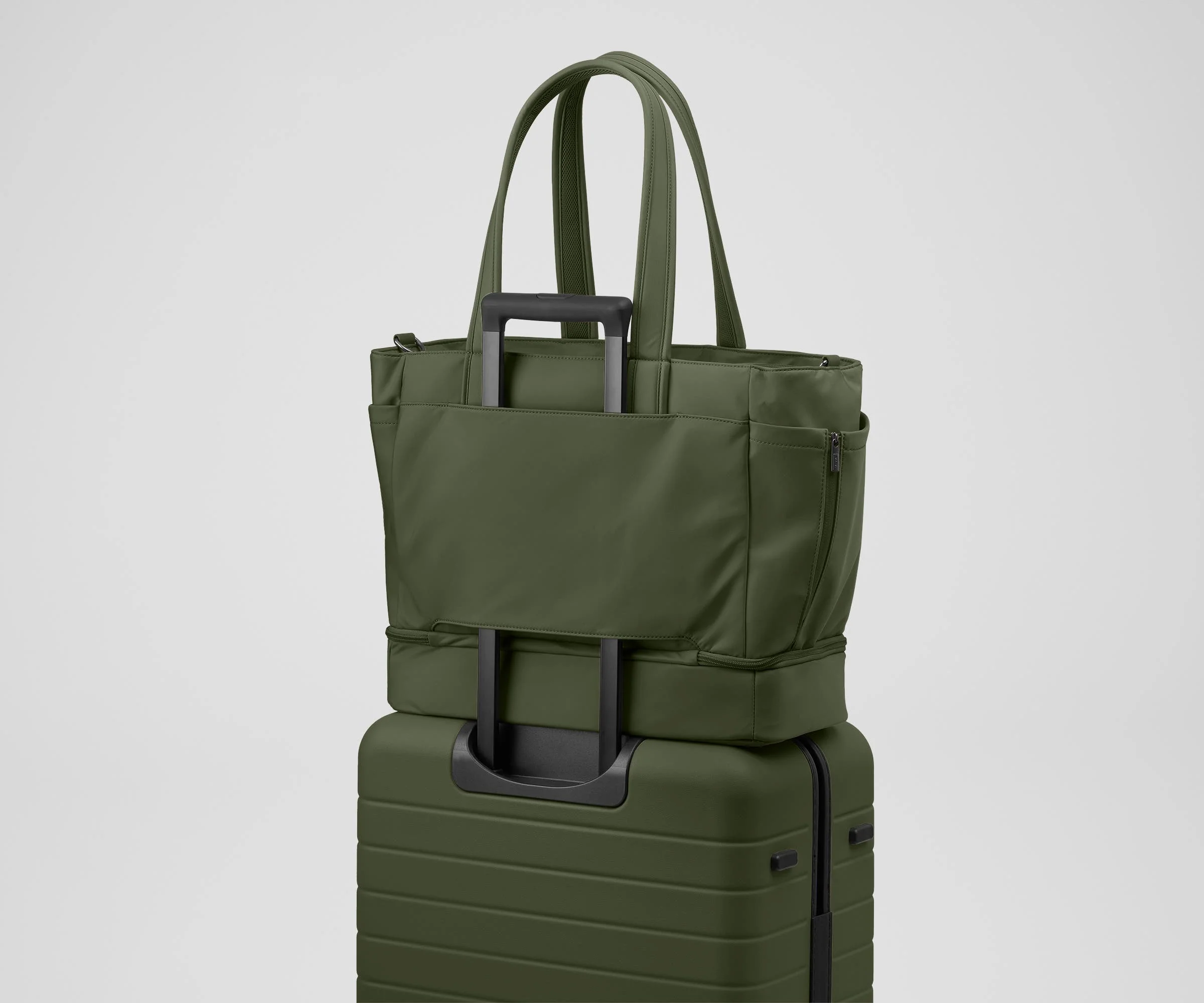 Double Diaper Tote on top of an Away suitcase by the trolley sleeve