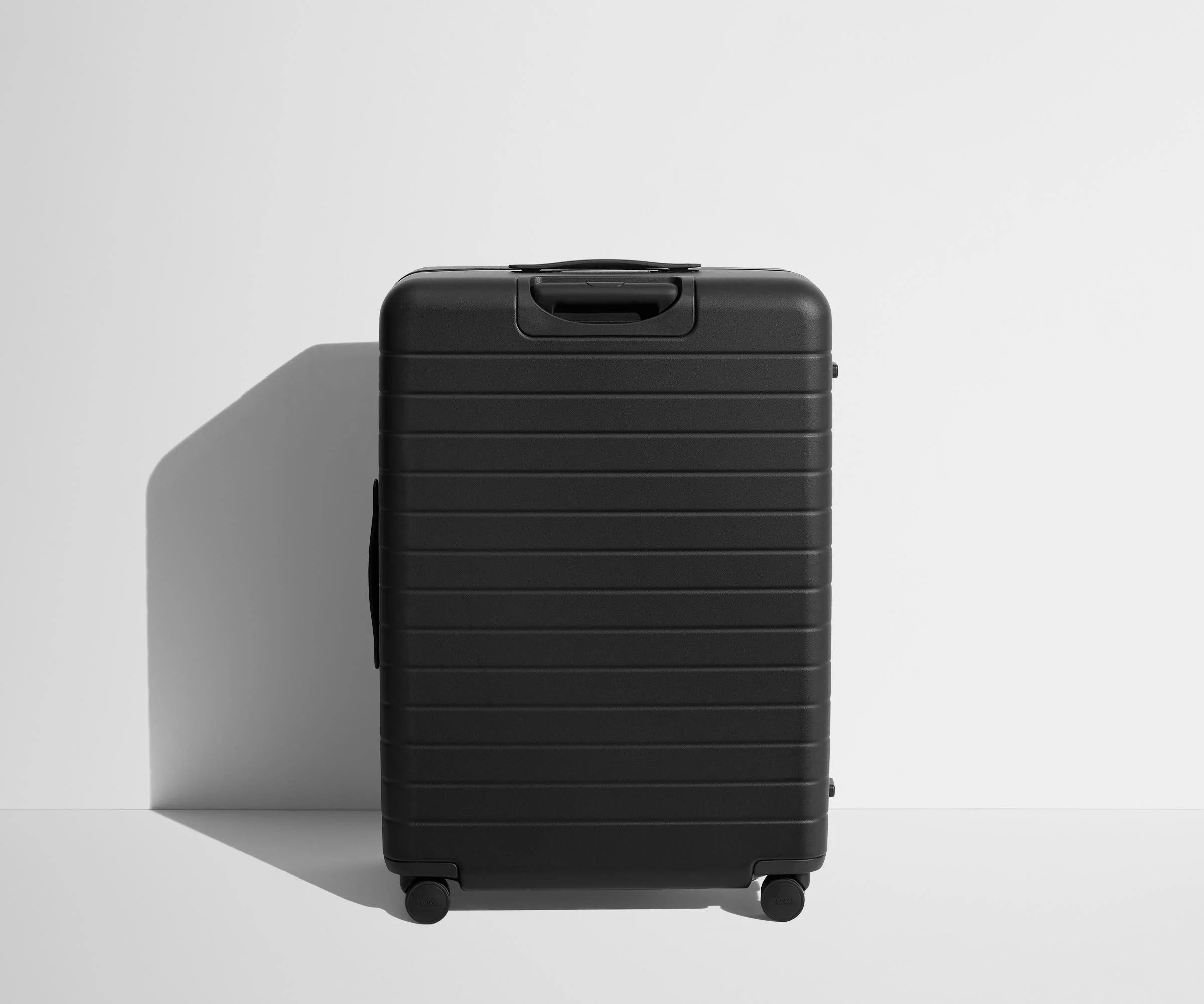 Back product view of The Large suitcase in Jet Black