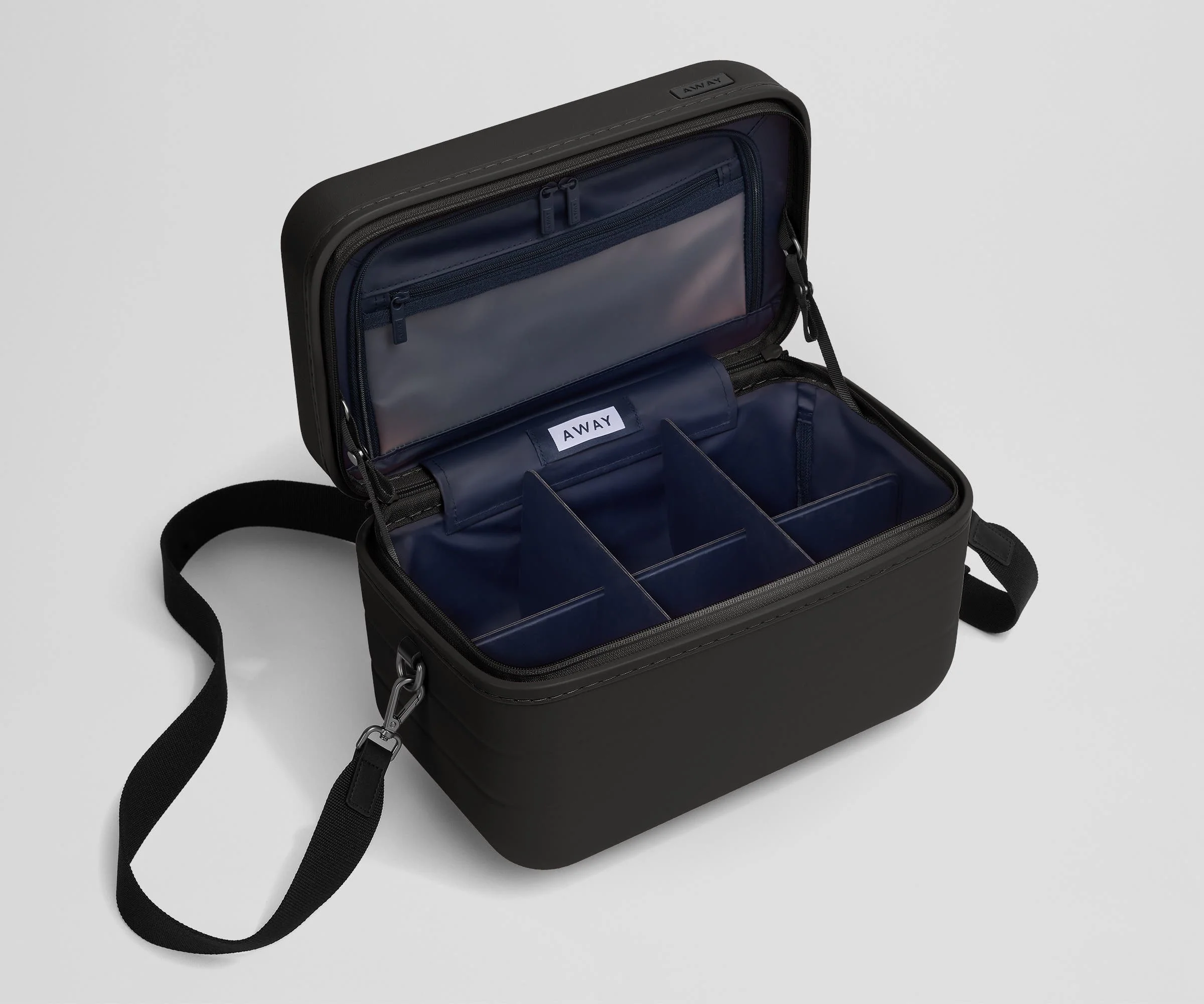 Removable fabric dividers in an empty Train Case