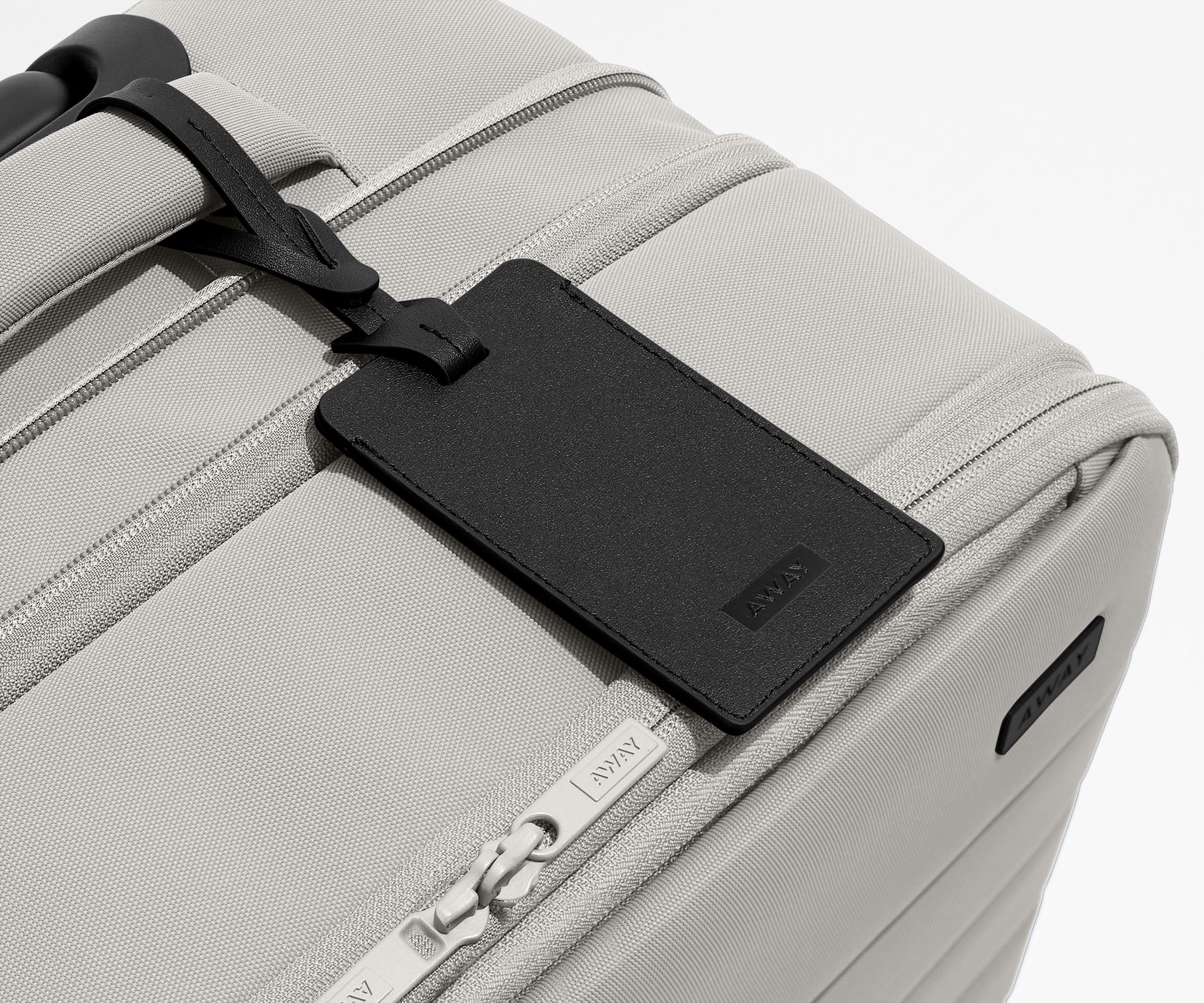Black leather luggage on that comes with the Softside suitcase