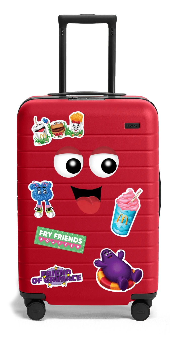 Illustrated red Away suitcase with McDonalds stickers