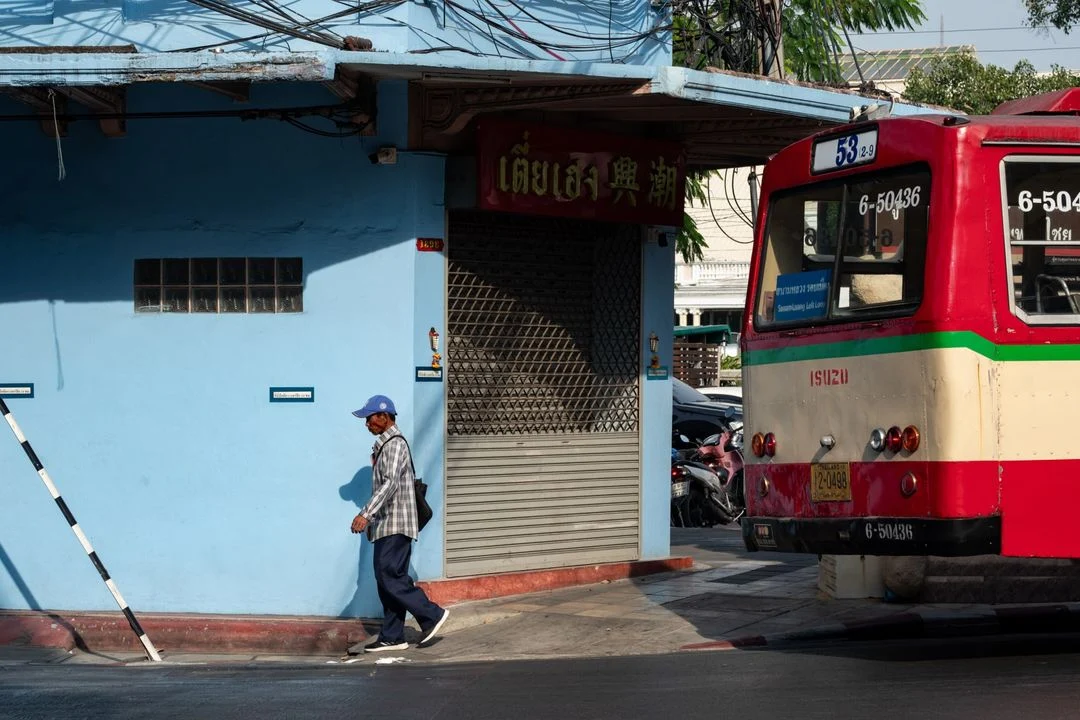 a scene of a bus station in Bangkok